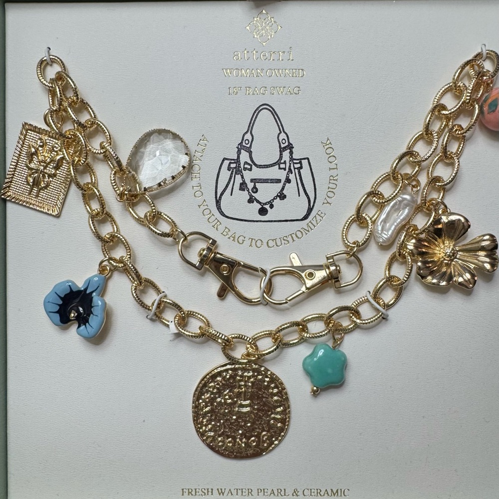 SOLD❗️ Gold Bag Charm Chain with blue and gold accents.